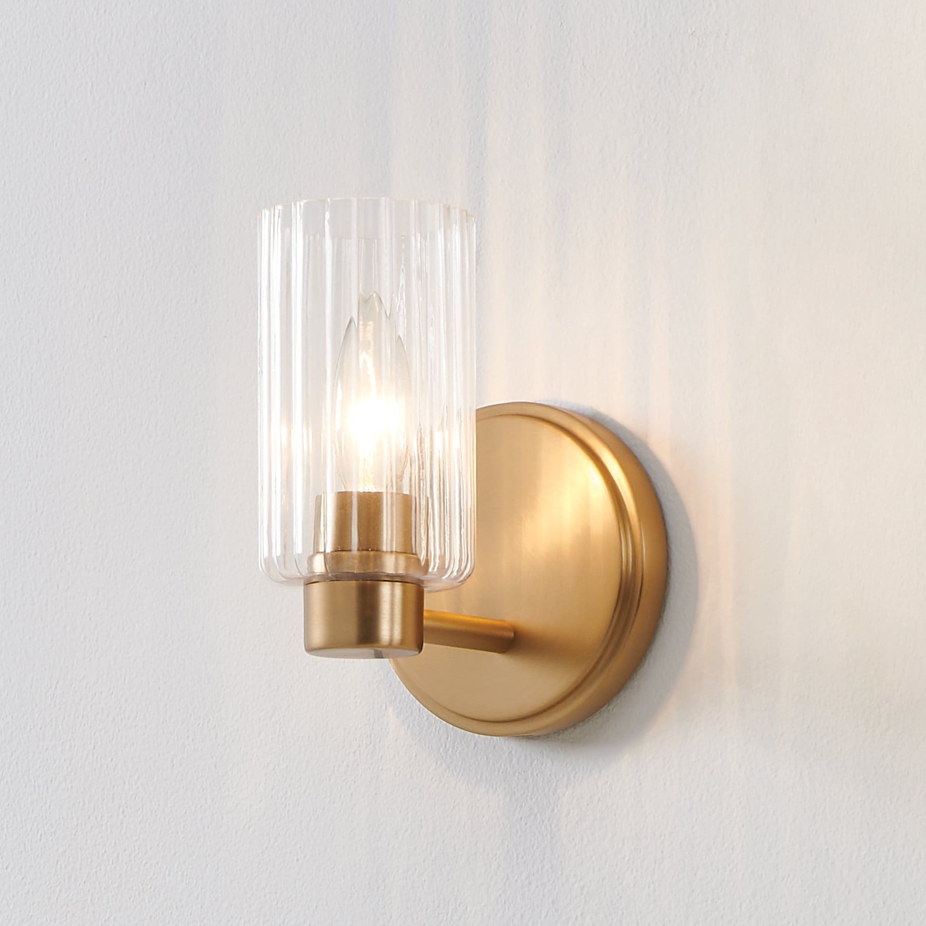 Thesis Bedminster 5-inch 1-light Champagne Gold Vanity Light with Clear Ribbed Glass Shade