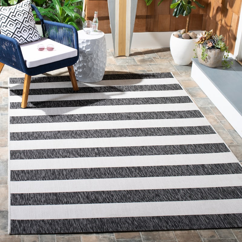 SAFAVIEH Courtyard Jetje Indoor/ Outdoor Waterproof Backyard Patio Rug - 8' x 10' - Ivory/Black