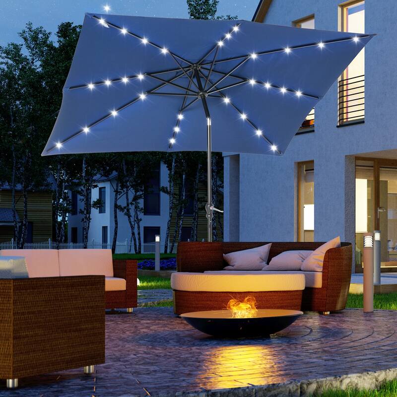 Outdoor terrace umbrella with tilting mechanism and LED lighting