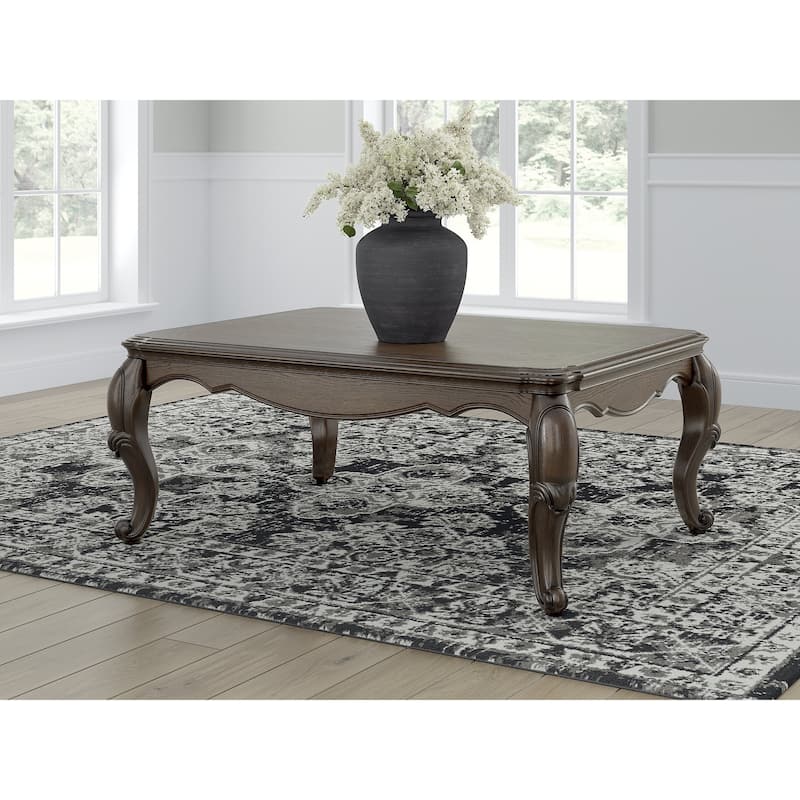 Signature Design by Ashley Maylee Dark Brown Coffee Table - 50" W x 37" D x 20" H