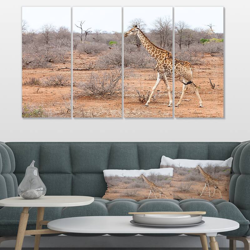 Designart "Giraffe Walking through African Forest" Modern Animal Canvas Wall Artwork Print