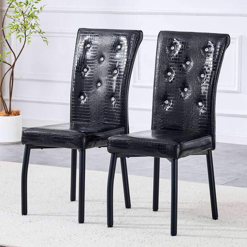 A set of 2 vintage crocodile leather cushioned dining chairs, featuring crystal clasp design and artificial leather design
