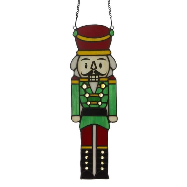 slide 2 of 7, River of Goods Cornelius 14-Inch Red and Green Holiday Nutcracker Tiffany-Style Stained Glass Window Panel - 4.25" x 0.25" x 14" Multi