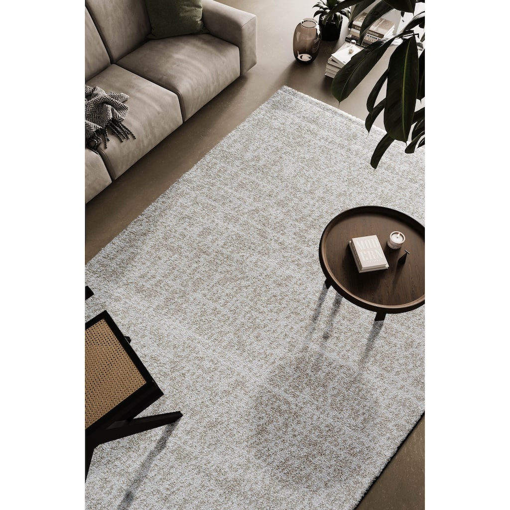 Matilda Ivory and Beige Polypropylene Area Rug - 9' x 12'