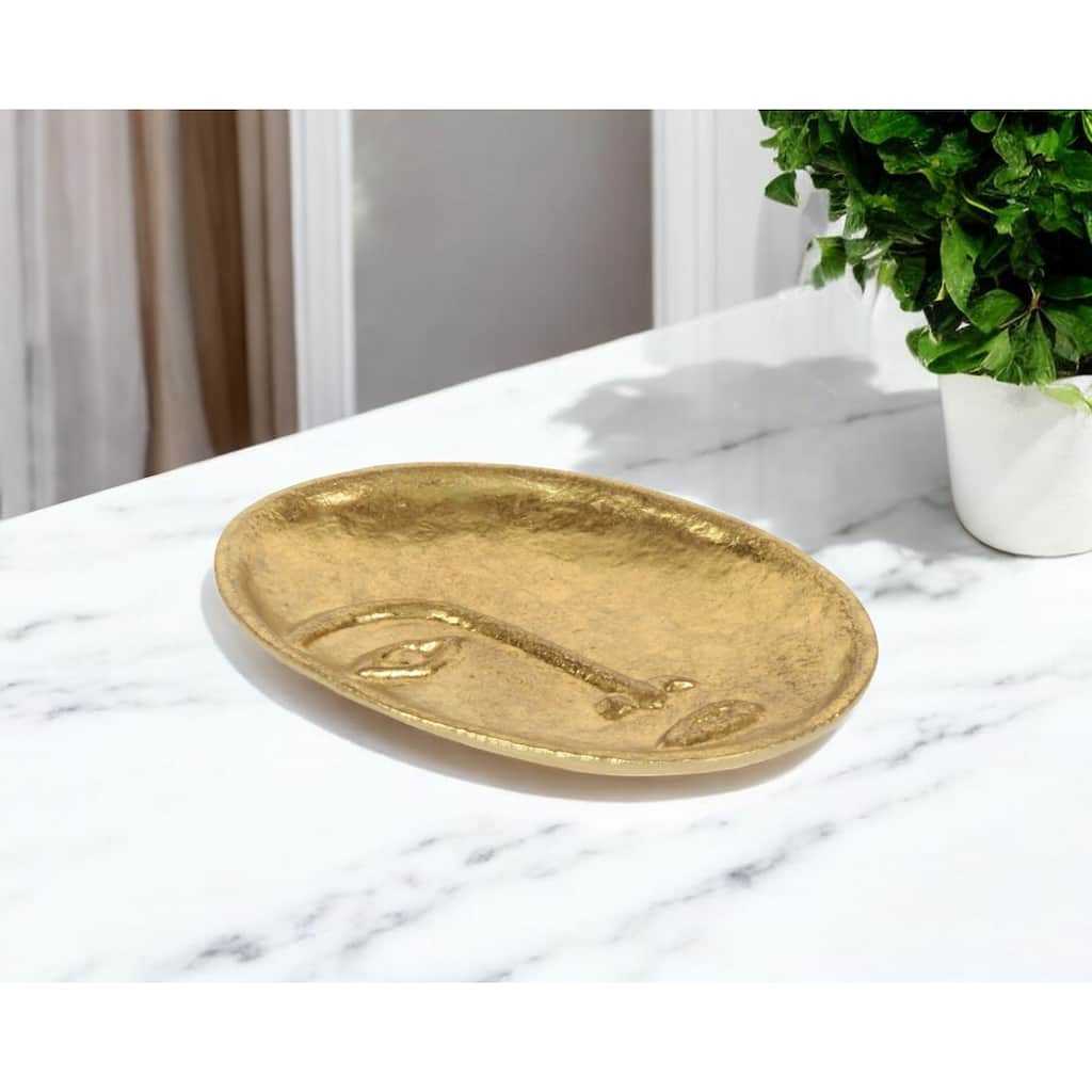 HomeRoots 8" Gold Cast Iron Mod Abstract Face Oval Trinket Tray