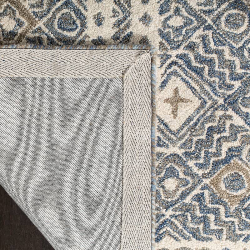 SAFAVIEH Handmade Micro-Loop Jelske Wool Rug