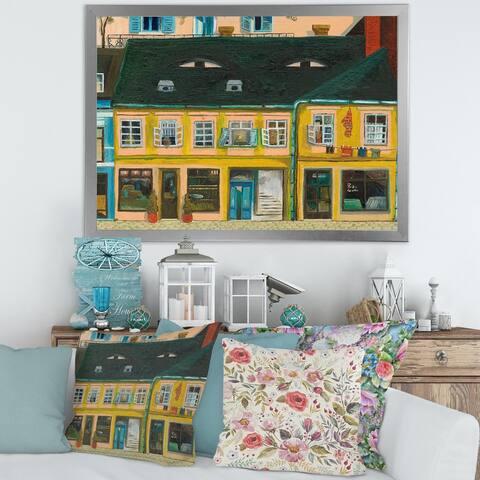 Designart "Yellow Facade of Houses In Street In Paris" French Country Framed Art Print