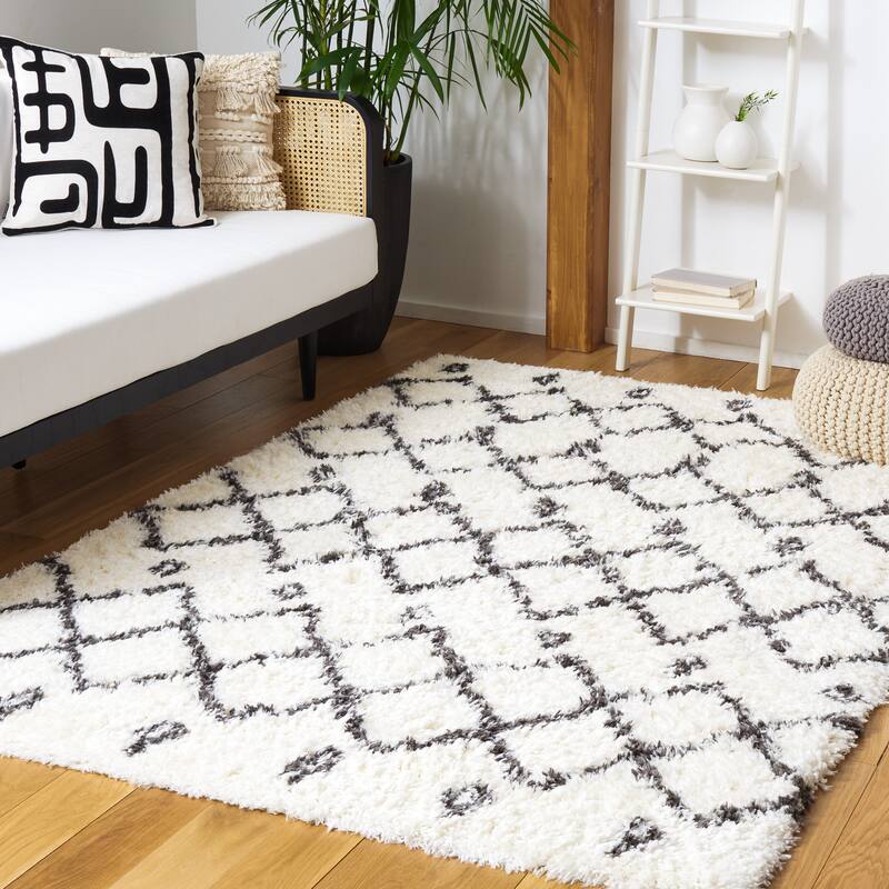 SAFAVIEH Handmade Flokati Theresie Shag Solid Polyester Rug - 4' x 6' - Ivory/Dark Grey