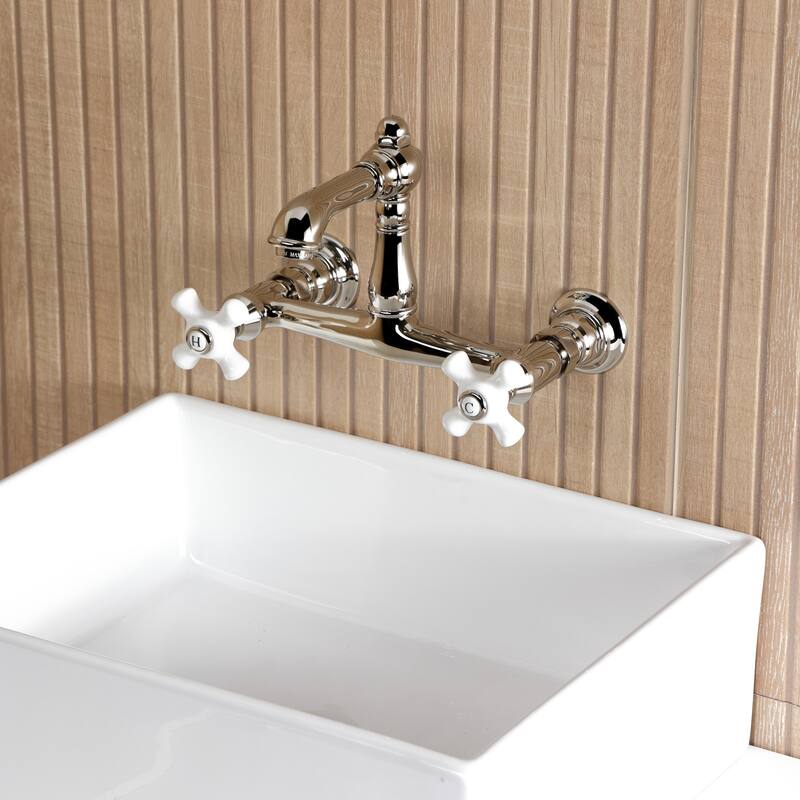 Kingston Brass English Country Two-Handle 2-Hole Wall Mount Bathroom Faucet