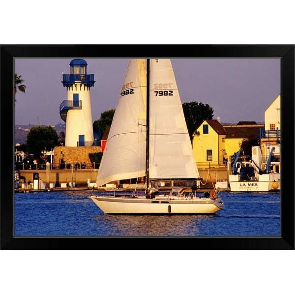 "Yacht sailing past lighthouse at Fishermen's Village, Marina del Rey" Black Framed Print