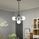 preview thumbnail 2 of 1, Teresa Black+Brushed Nickel 4-Light Globe Glass Shade Metal Chandelier