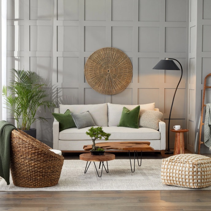 Coastal living room with beige sofa and modern floor lamp.