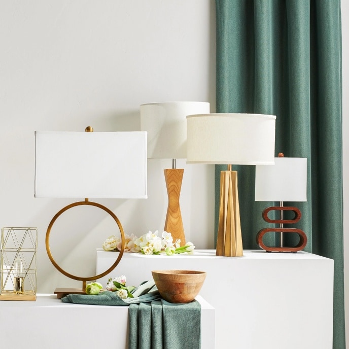 Four glam, modern table lamps with unique designs.