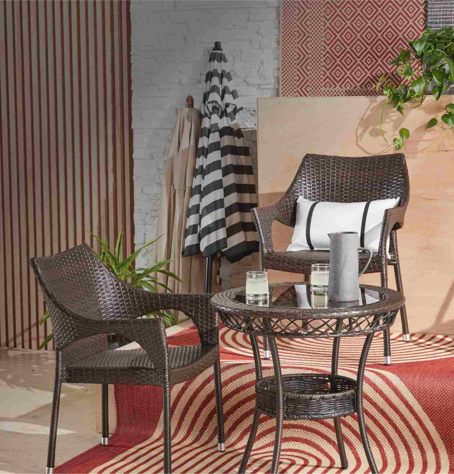 A showcase of outdoor furniture and decor with a large aluminum rocking chair and side tables available at Overstock
