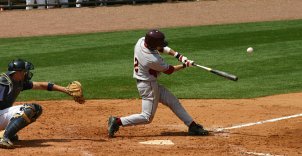 Professional athletes playing with baseball equipment