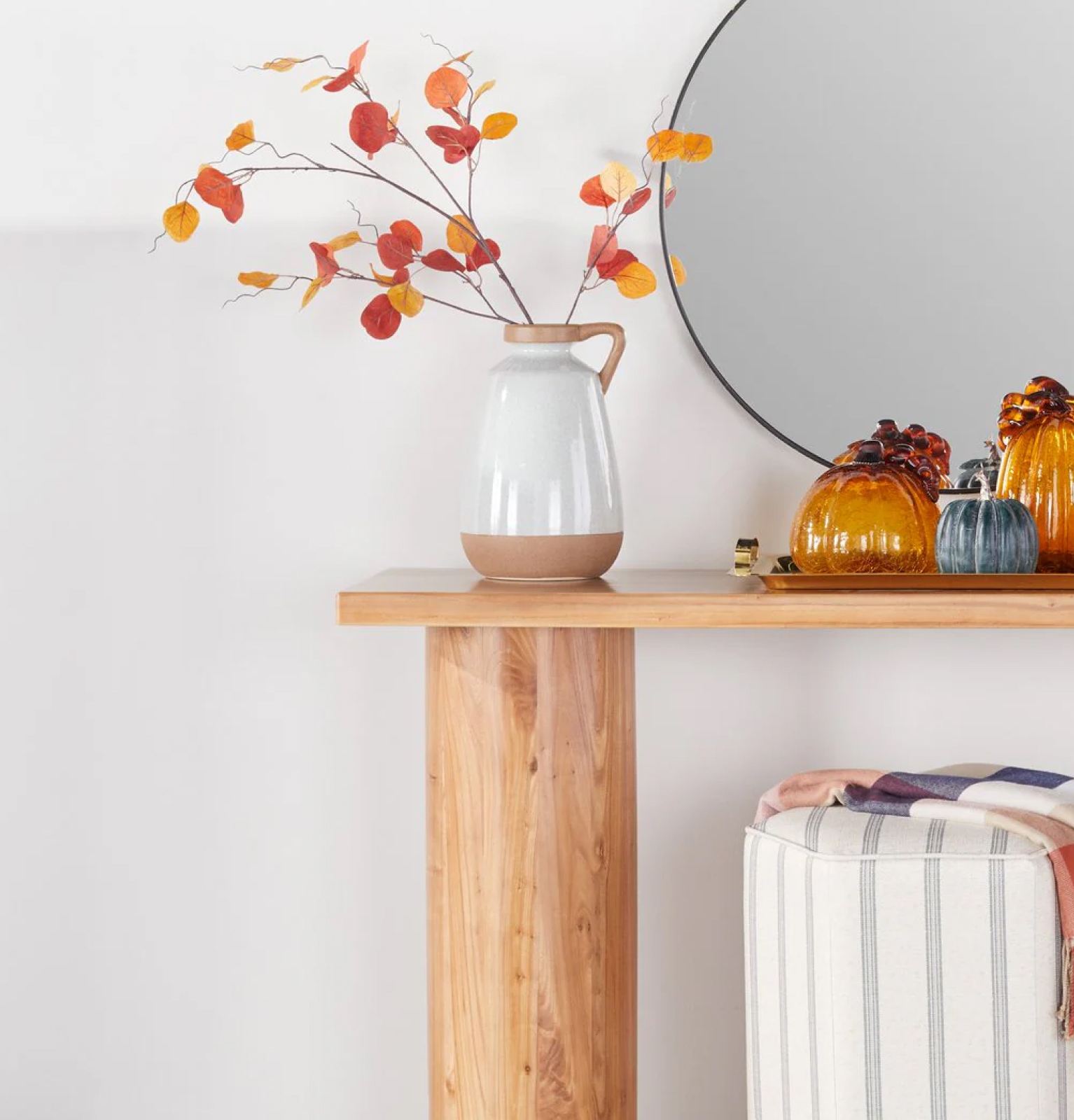 Natural wood console table with fall-themed decor, candles, and planter. Fresh fall decor from $19. Shop now.