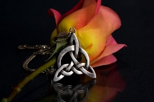 Celtic knot necklace and a beautiful pink rose