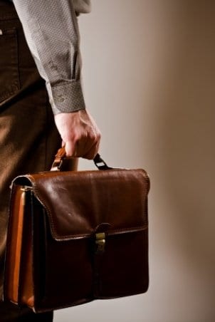 Man carrying a leather briefcase