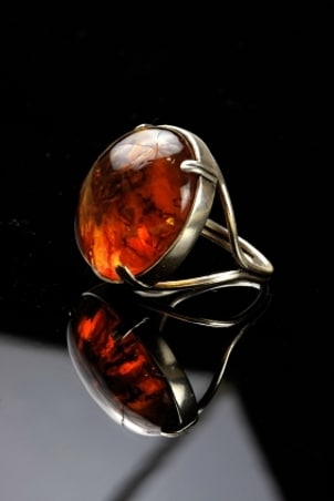 Mens gemstone jewelry ring with an amber gem