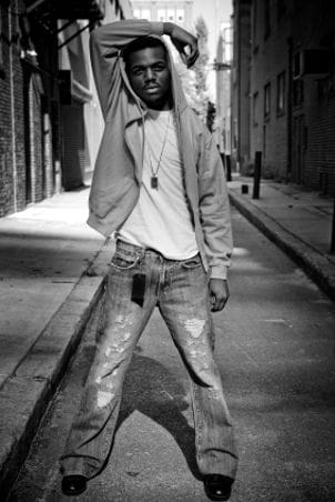 Man wearing mens T shirt, hoodie and torn jeans