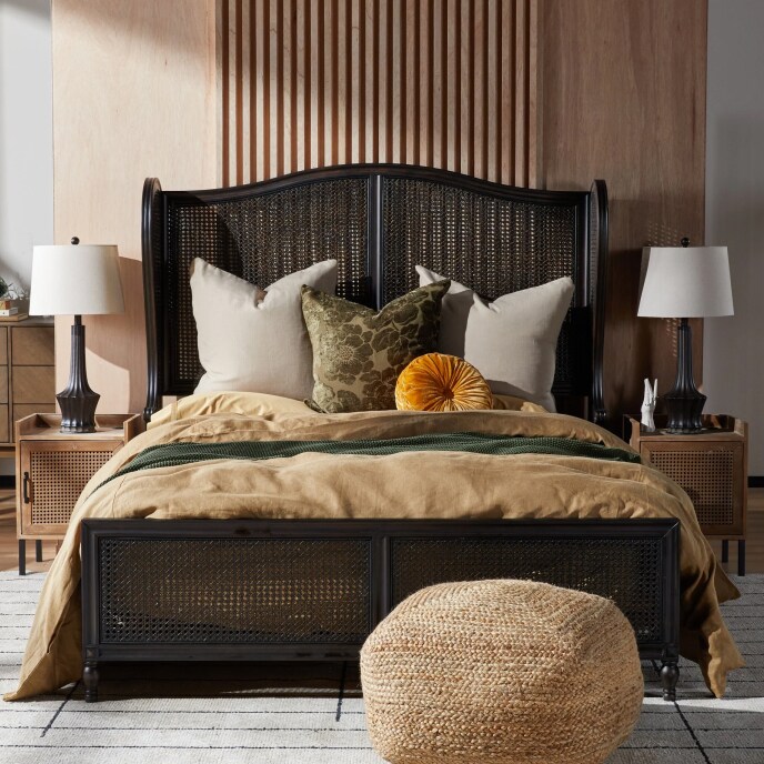 a high bed layered with several throws and pillows available with other comfortable bedding at overstock