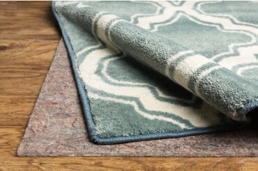 Choose Your Rug Pad Type Rug pulled back to expose rug pad