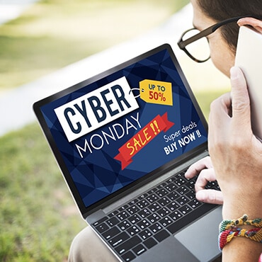 Do Your Homework Man using laptop to look up Cyber Monday deals
