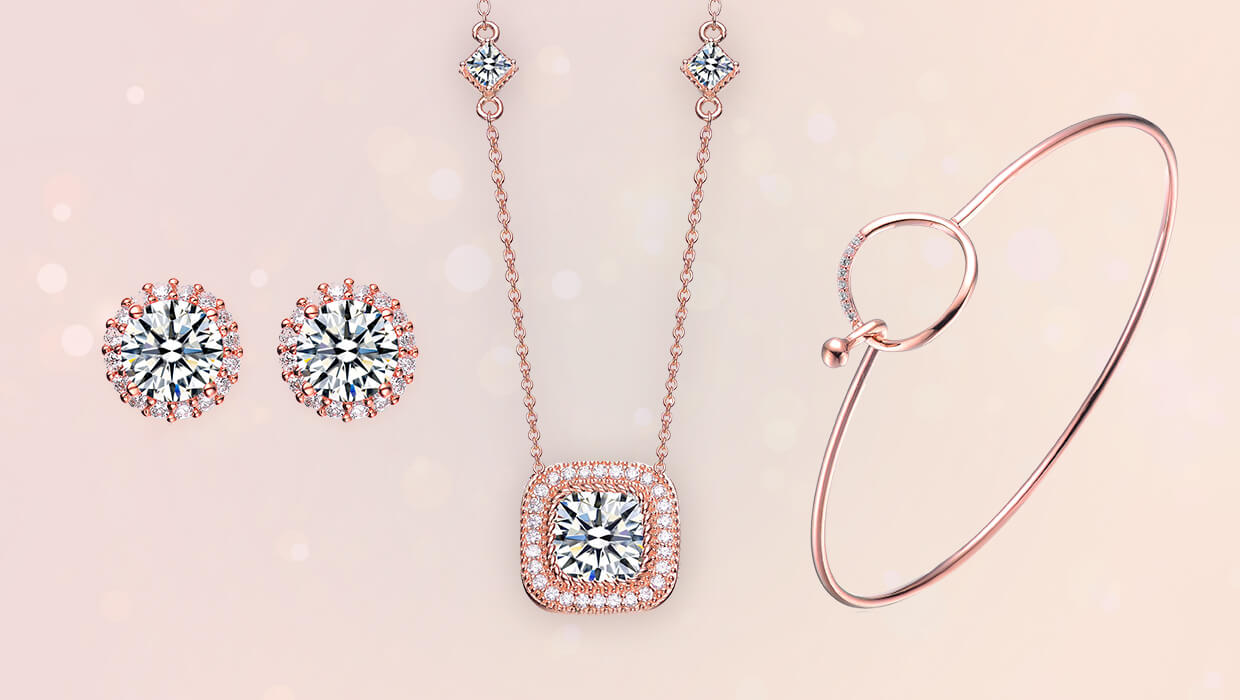 Collage of rose tone jewelry featuring a ring, necklace, and bracelet