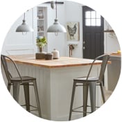 White kitchen island with farmhouse-style barstools