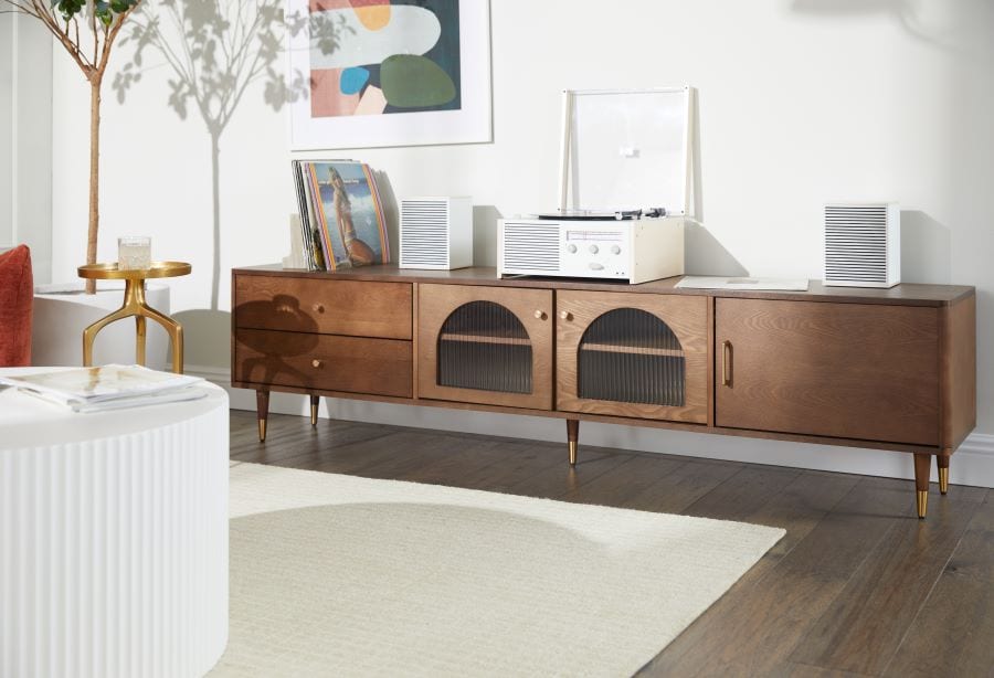Record player on a console table with records