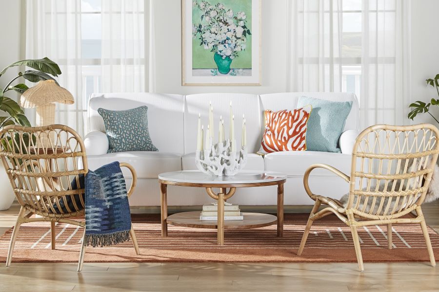 Living room with white sofa and wicker chairs
