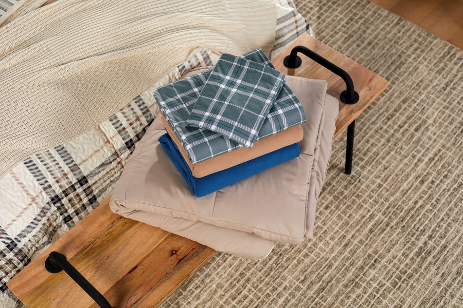 Pile of folded sheets on a bench
