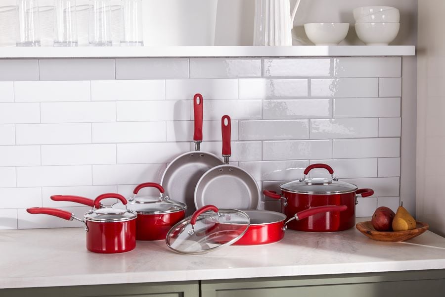 Display of red pots and pans on a counter
