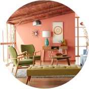 Mid-century modern living room with wall art and stylish chairs