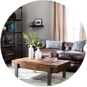 Rustic living room with a wooden coffee table and a leather sofa