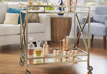 Glam barstool with polished copper barware and glass decanters