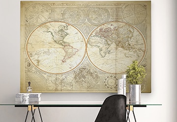 Stylized map of the world hanging over an office desk