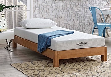 Child’s mattress on a wooden platform bed