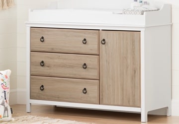 White changing table with brown drawers and cabinets