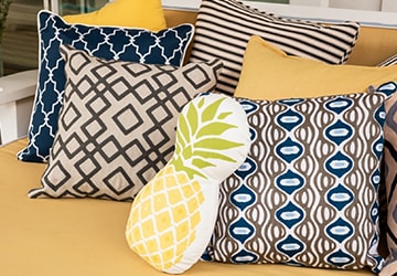 Outdoor pillows with various patterns in a variety of colors