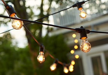 String lights hanging over an outdoor space