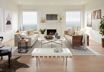 Living room with southwestern style wall art, a faux cowhide rug, and stylish furniture