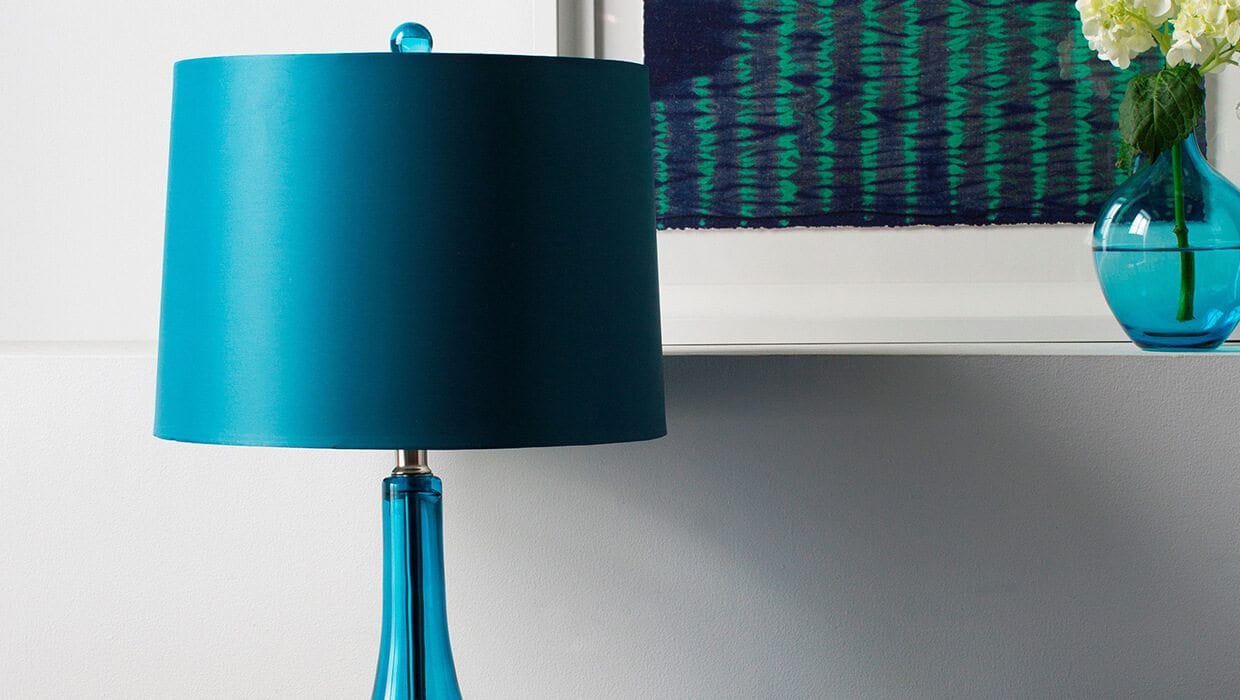 A blue lamp with blue shade