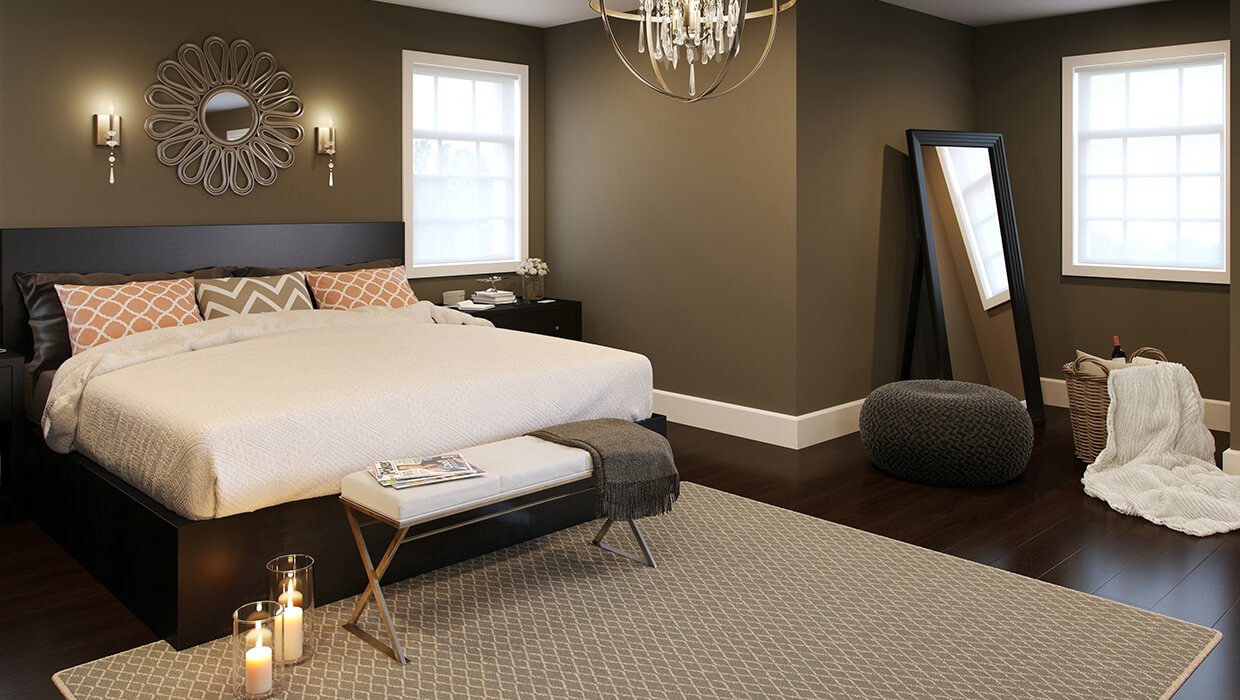 Wall sconces above a bed in a bedroom