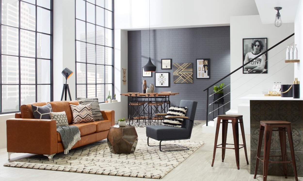 A living room featuring a rug with a geometric pattern